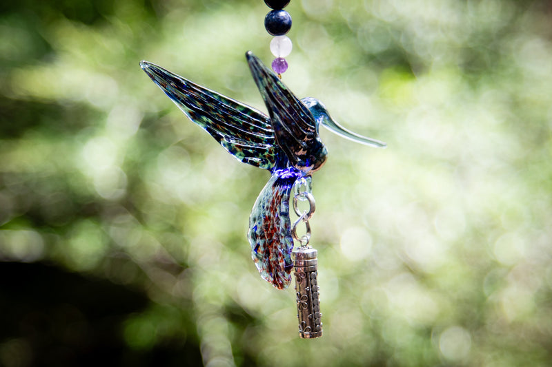 hummingbird with silver keepsake pendant